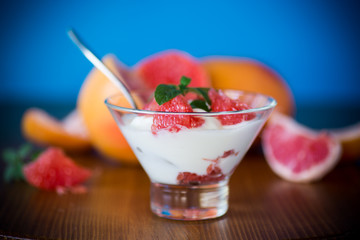 sweet homemade organic yogurt with slices of red grapefruit