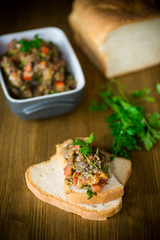 eggplant caviar with tomatoes and a slice of bread