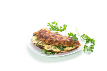 fried omelet with cauliflower and greens in a plate