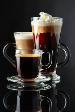 Various coffee drinks on a black background.