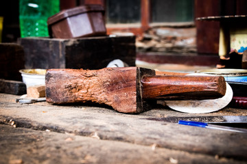 Carpenter wooden hammer on table big brown