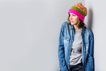 Beautiful woman in colorful pink knitted hat portrait 