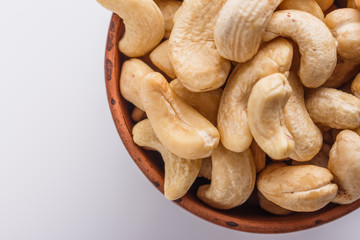 cashew nuts on a white acrylic background