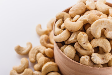 cashew nuts on a white acrylic background