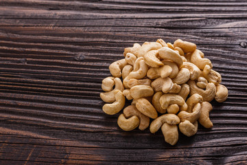 cashew nuts on a rustic wooden background