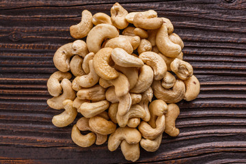 cashew nuts on a rustic wooden background