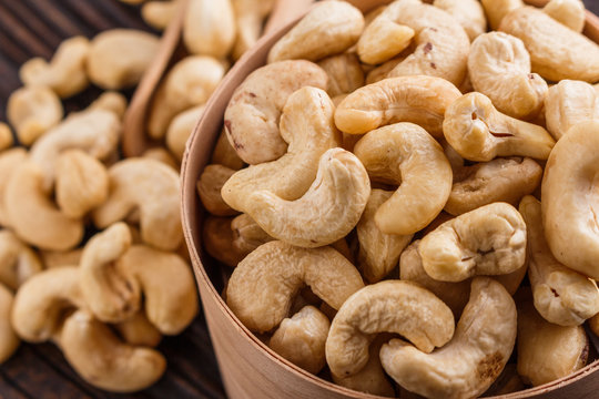 cashew nuts on a rustic wooden background