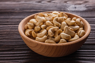 cashew nuts on a rustic wooden background