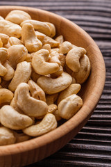 cashew nuts on a rustic wooden background