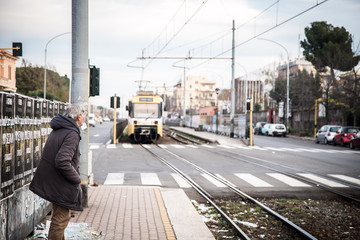 Fototapeta na wymiar old man waiting for the train