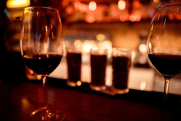 Red wine and Christmas light reflection with soft focus