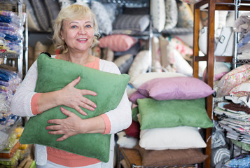  mature woman consumer with pillow