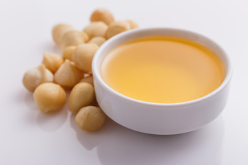 delicious macadamia nuts on a white acrylic background