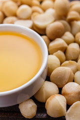 delicious macadamia nuts on a wooden rustic background