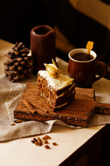 Christmas cake with cinnamon and coconut. Hot chocolate and tea, a cozy festive evening. Recipe for homemade traditional cake.