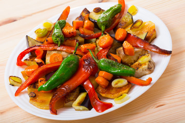 Tasty baked vegetables at plate, healthy vegetarian food