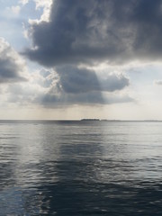 Beautiful Cumulus clouds over the ocean in Maldives