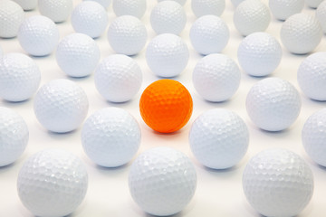 Pattern with white and orange golf balls