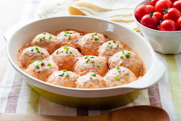 Chacken meatballs baked in creamy tomato sauce