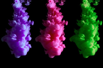 Obraz premium Original visualization of trend colors in 2018: UFO green, Plastic pink, proton purple, paint stream in water, abstract background