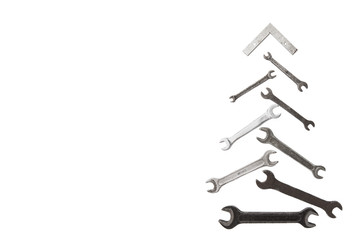 christmas tree figure made of old rusty wrench isolated on white