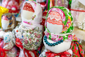Dolls in the ancient national Russian clothes on the counter of the gift shop.