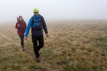 Man and woman hiking on the mountain