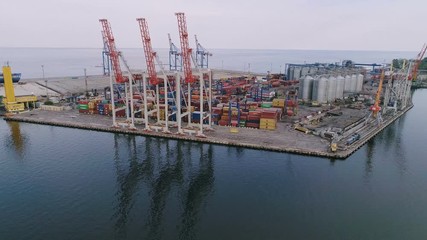 Aerial of industrial seaport with huge cranes and platforms in Odessa in summer