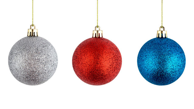 Christmas balls hanging on a white background. Several christmas balls isolated on white background.