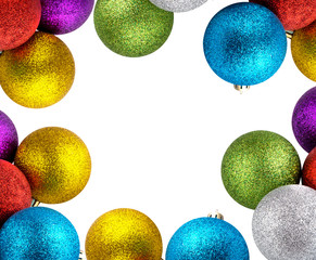 Christmas balls on the edge of a white background. In the center of the frame is a white background for text. Several christmas balls isolated on white background.