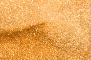 orange falling metallic dust on pile texture - cute abstract photo background