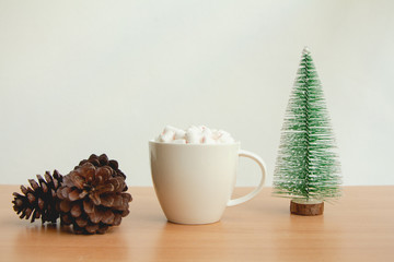Fluffy white marshmallow in white cup on wooden table,Hot chocolate,Minimal.