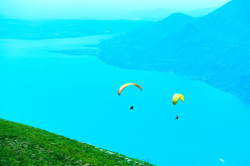 Paragliding over lake Garda in Italy