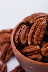 delicious pecan nuts on a white acrylic background