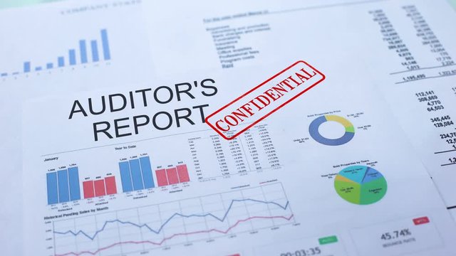 Auditors report confidential, stamping seal on official document, statistics