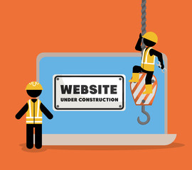 website under construction with laptop