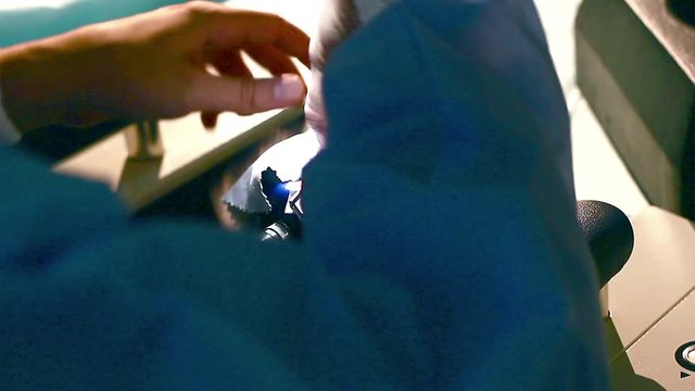 laser for vision correction, Surgeon's hands in gloves performing laser eye vision correction correction, medical laser close up, Doctor is testin a medical laser