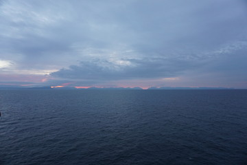 Sunset with clouds when arriving at the Faroe Islands from the MS Norröna
