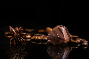 candy, chocolate, filler, cream, coffee  (Black background). food background. copy space