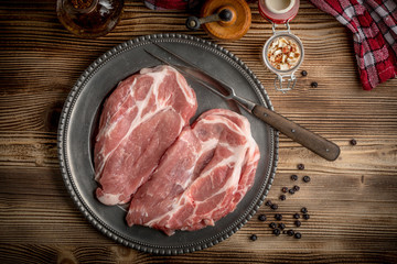 Slices of raw pork neck.