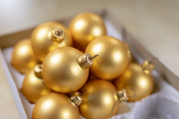 Old Christmas balls on a wooden table. Christmas decorations prepared for tuning the tree.