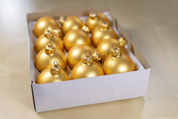 Old Christmas balls on a wooden table. Christmas decorations prepared for tuning the tree.