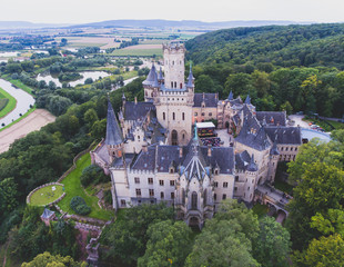 Obraz premium View of Marienburg Castle, a Gothic revival castle in Lower Saxony, Germany, near Hanover, drone aerial view