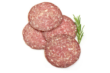 Thinly Sliced Salami with herbs, isolated on a white background. Top view