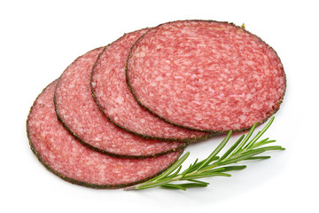 Thinly Sliced Salami with herbs, isolated on a white background. Close-up