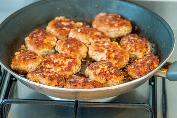 cutlets fried in a pan