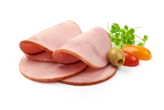 Fresh Cooked Ham with parsley and tomatoes, isolated on a white background. Close-up