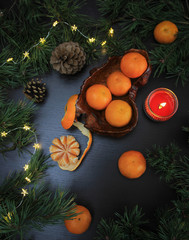 Mandarins in flat lay. Mandarins in still life composition for christmas.  Clementines and christmas decorations