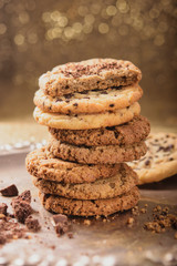Healthy homemade, oatmeal cookies on a golden background. Baking for Christmas and New Year.