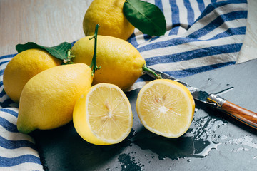 fresh lemons with green leaves